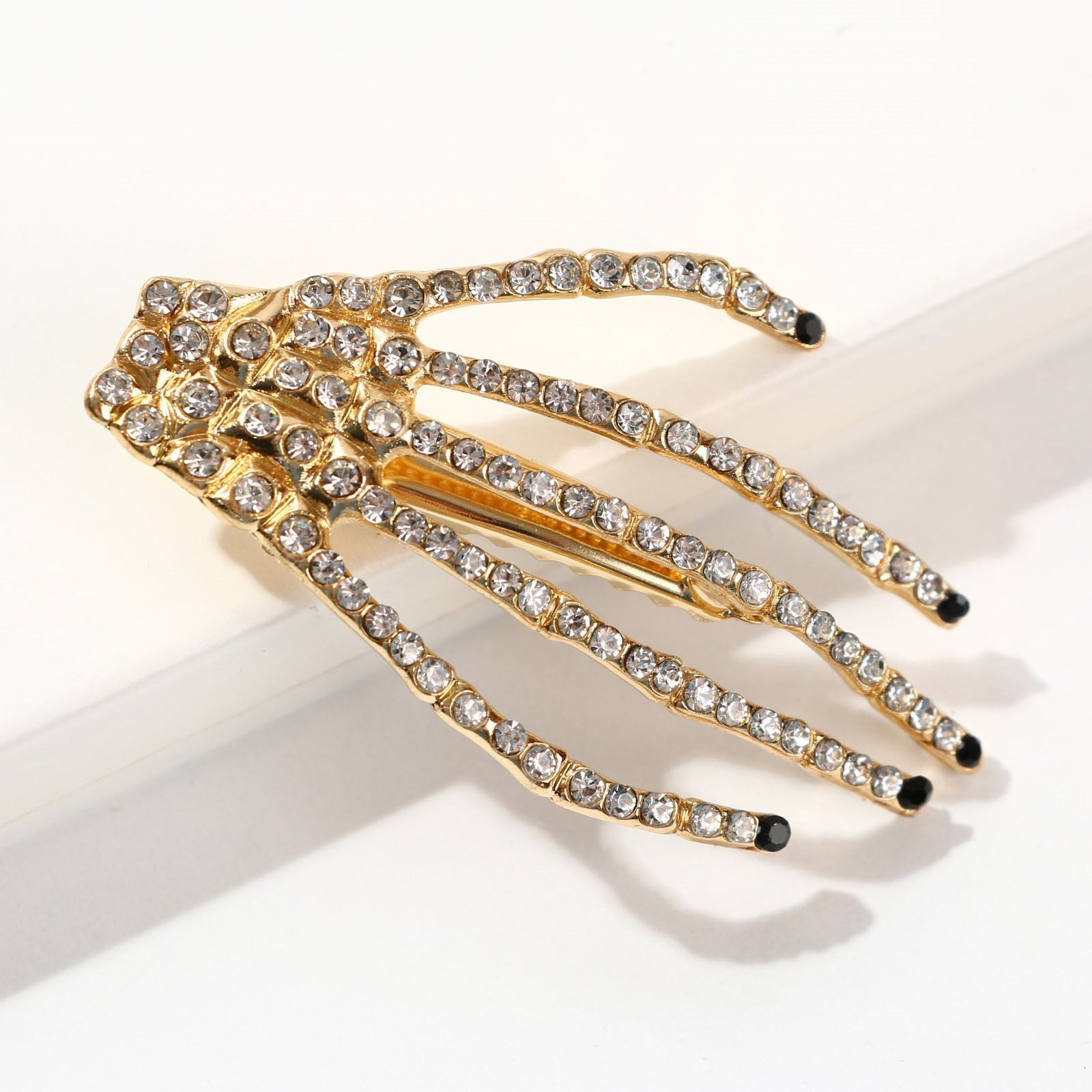 картинка Заколка «Рука скелета» от магазина Одежда+